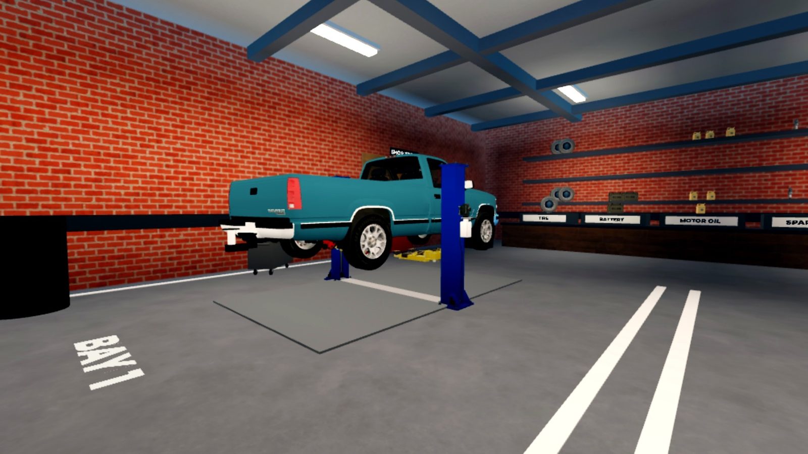 A customer's car raised on a two-post lift